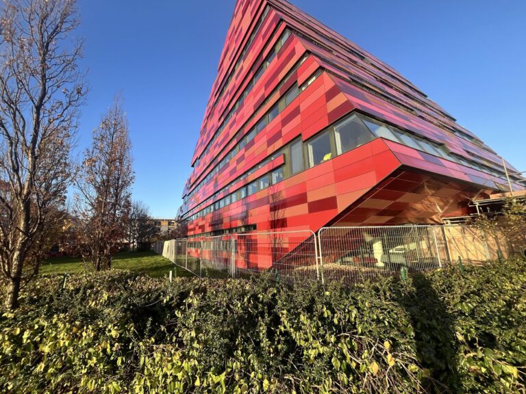 Yang Fujia building at Jubilee Campus at The University of Nottingham. A large multi storey building, with mixed red title like cladding.