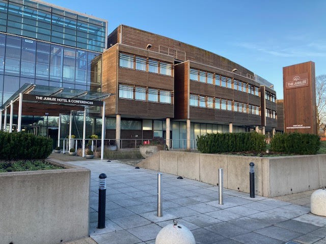 Large brick and glass building that is part of the University of Nottingham campus.