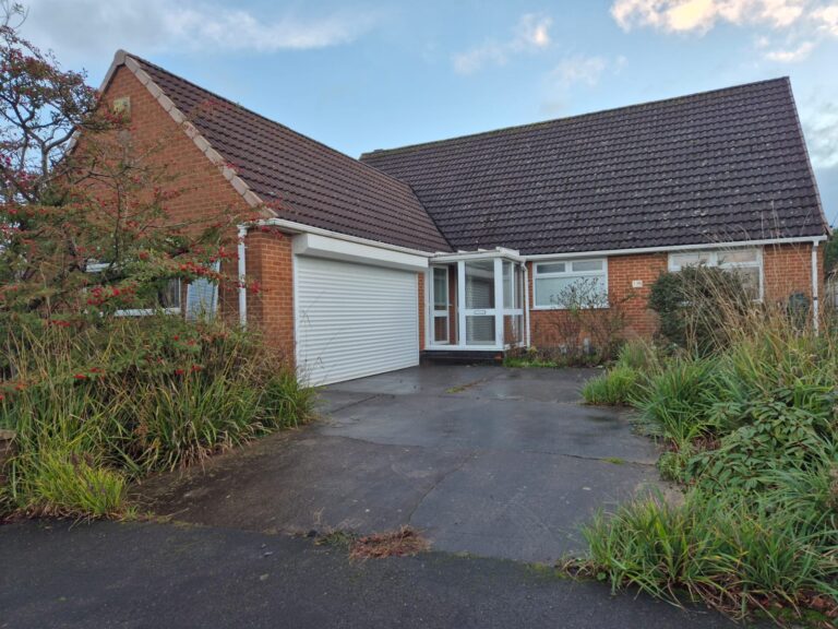 L-Shaped Bungalow on Locko Road in Spondon, Derby. Bungalow is traditional with a white Garage door, porch and driveway. Contemporary New Home Spondon.