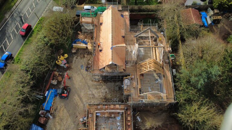 Aerial photograph of Plot 3 on The Paddocks in Bradmore, Nottingham new housing development by Allsopp Constuction. a building site of three new homes in Bradmore in Nottingham. You can see the shape of the house and the roof taking shape.