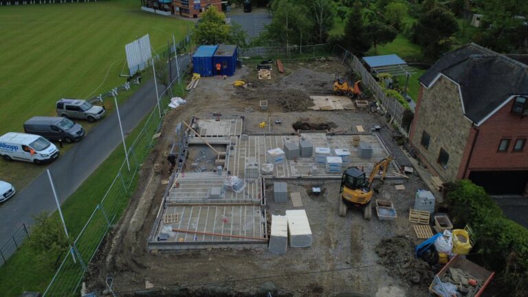 Drone image of Progress Update on Contemporary New Home in Spondon. Image shows site and foundations and surrounding land.