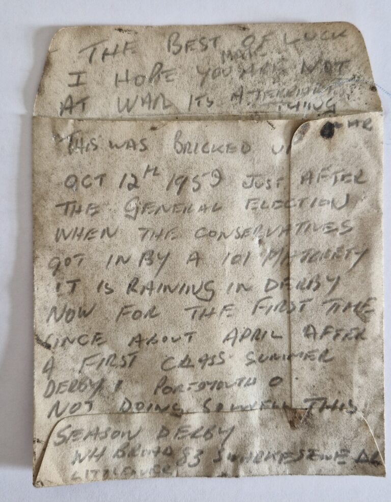 Handwritten note dated 12 October 1959 found hidden beneath a staircase during the refurbishment of The Liversage Trust almshouses in Derby. The weathered note records local events, the General Election and Derby County's football results.